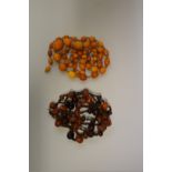 A graduated butterscotch amber bead necklace, 77.5cm long, 23.6g; together with a faceted cherry