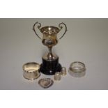 A small group of silver items, to include a trophy cup; napkin ring; and thimbles, 72g weighable.