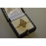 A diamond pave set marquis gold ring, stamped 18k, 6.3g total weight.