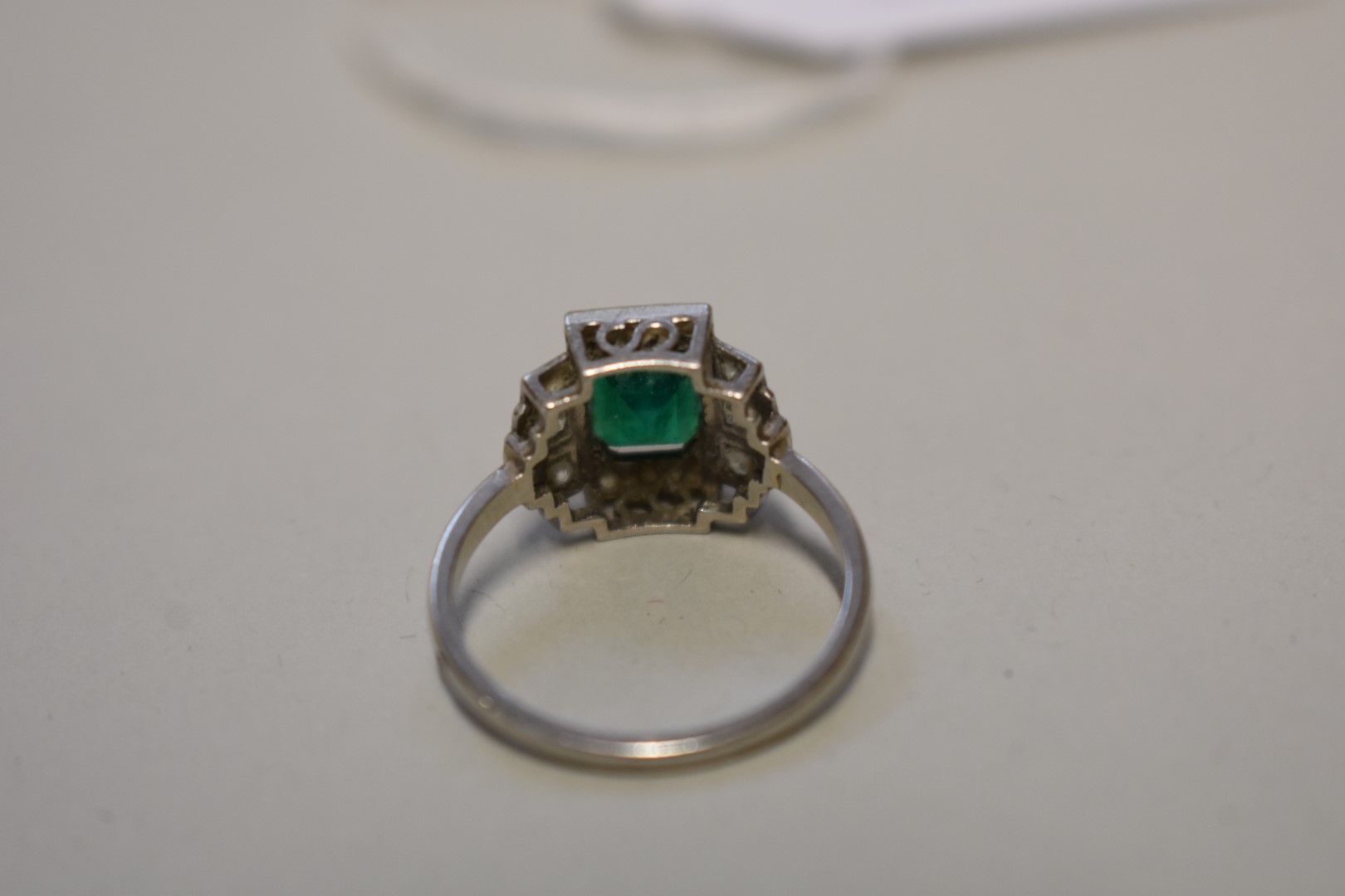 An Art Deco style square cut emerald and diamond unmarked white gold ring, 4.5g total weight. - Image 3 of 3