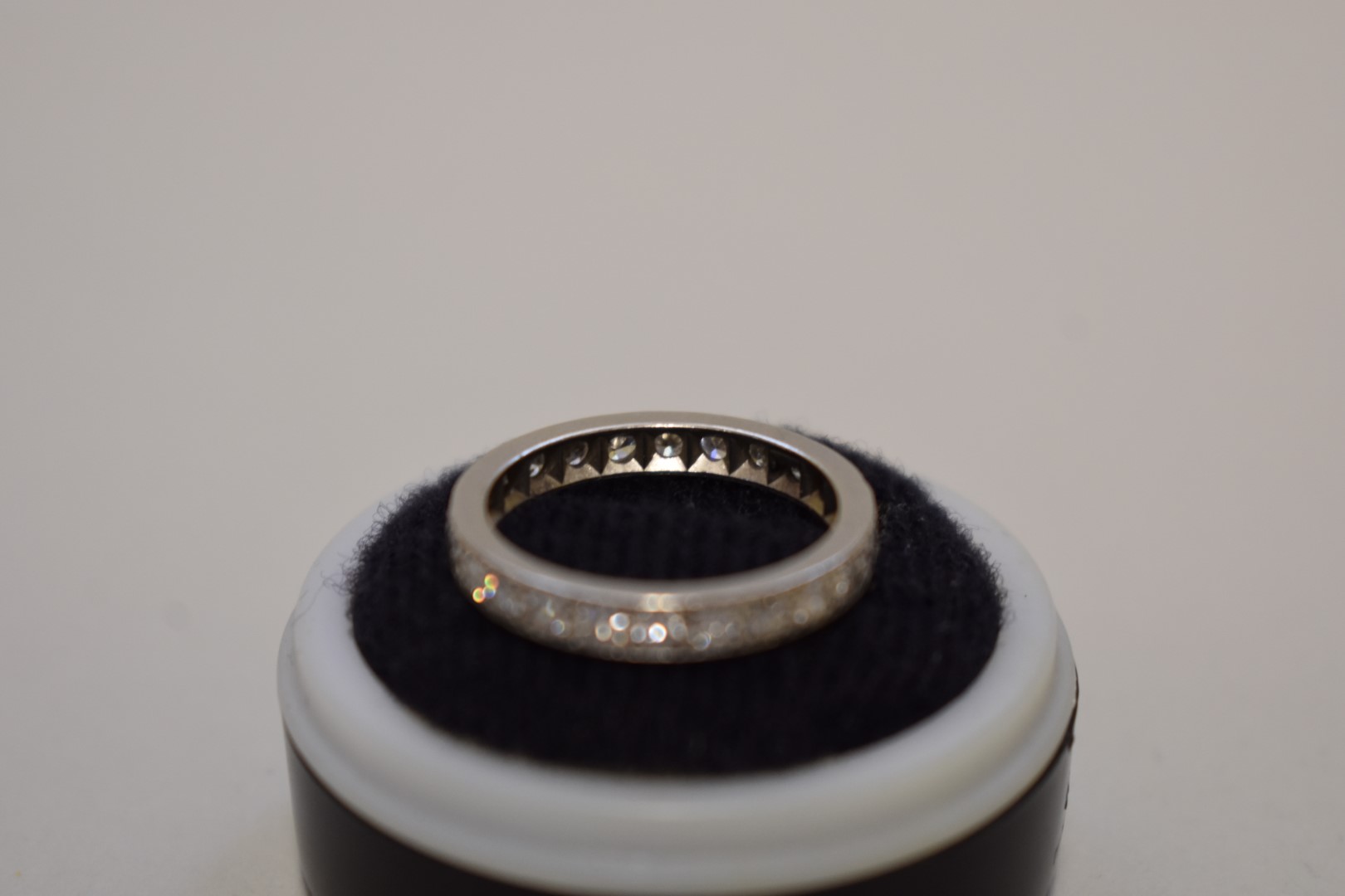 A diamond set unmarked white metal eternity ring, 4.2g total weight. - Image 3 of 3