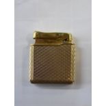 A Calibri 9ct gold and gilt metal lighter, removable hallmarked cover 18g.