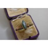 A moss agate carved cameo gold ring, stamped 9ct, 2.3g total weight.