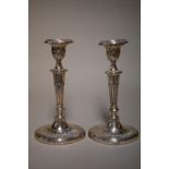 A pair of Edwardian silver candlesticks, by Barker Brothers, Chester 1906, 22cm high.