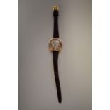 A circa 1936 Rolex 9ct gold manual wind wristwatch, 27mm, on associated leather strap.