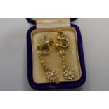 A pair of pearl and 15ct gold screw back earrings, 3.2g total weight.