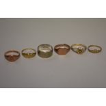 Five various 9ct gold rings; together with a white gold wedding band stamped 9c, 14.2g.