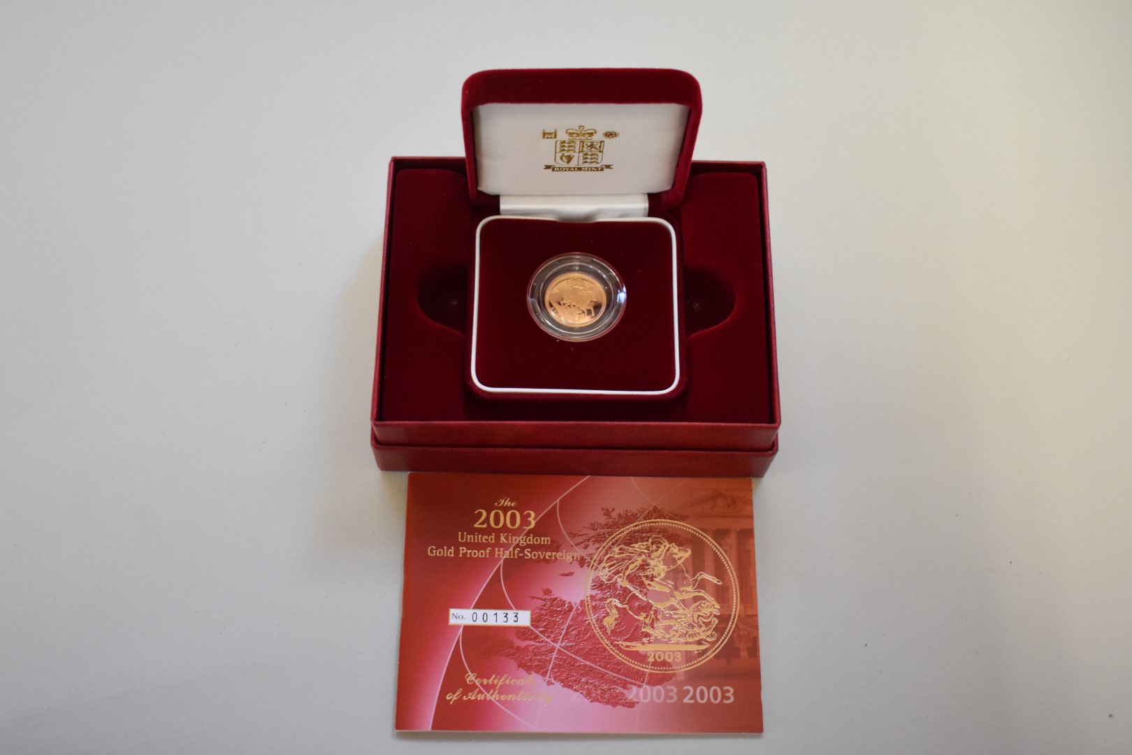 An Elizabeth II 2003 gold proof half sovereign, boxed.