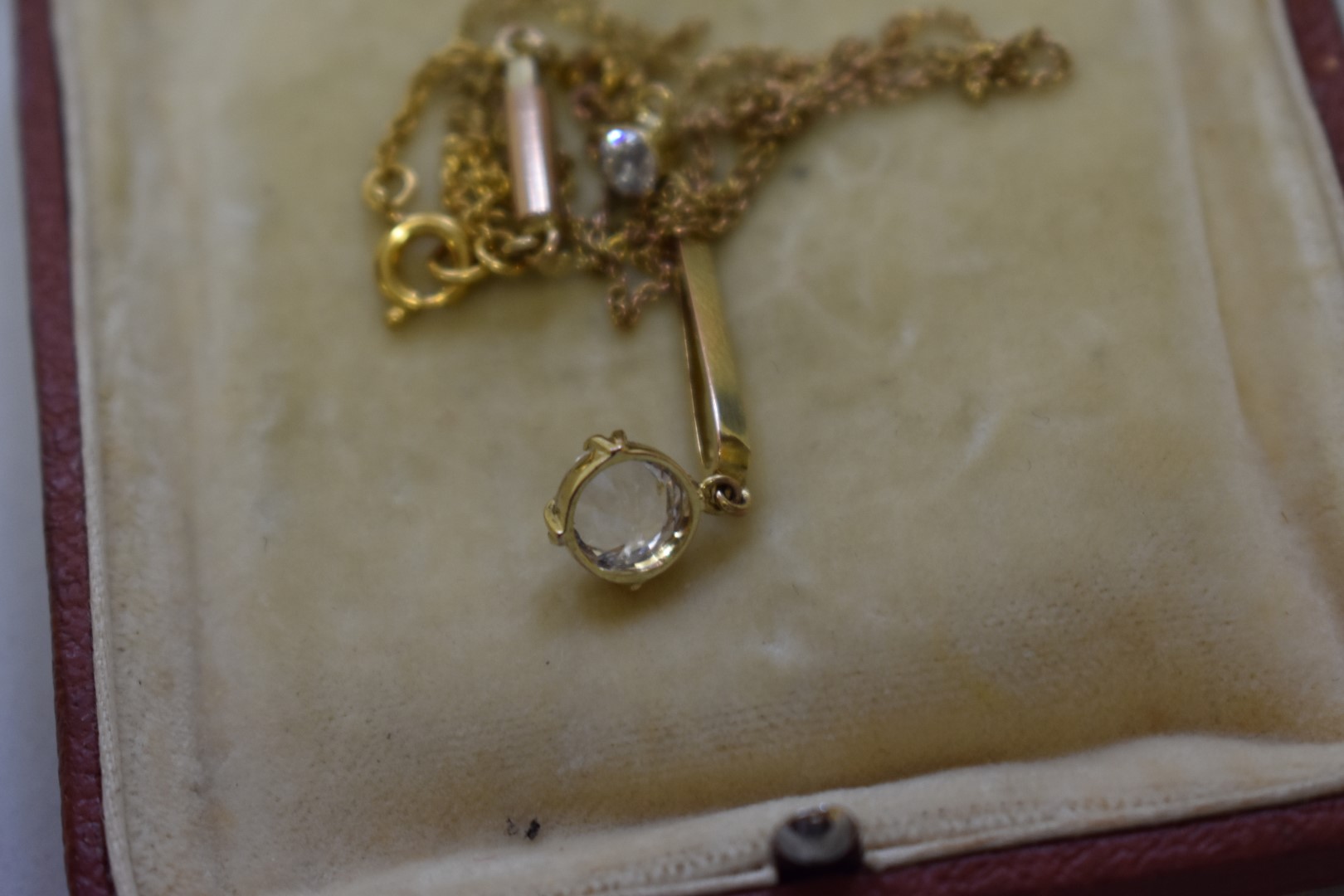 A diamond and paste unmarked yellow pendant on fine chain. 2.9g total weight. - Image 2 of 2