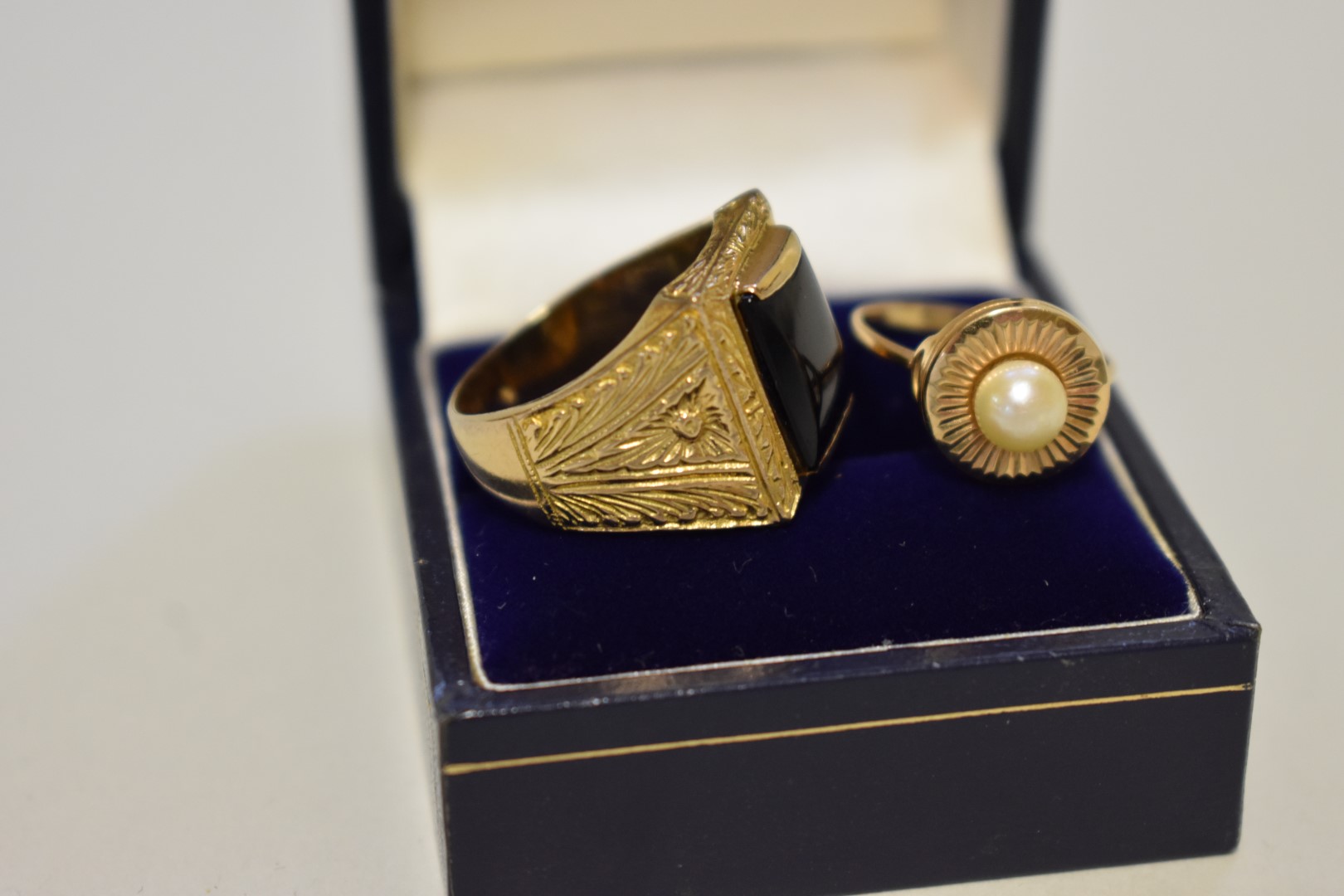 An onyx unmarked yellow metal gentleman's ring; together with an unmarked yellow metal pearl ring, - Image 2 of 3