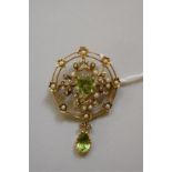 A peridot and seed pearl pendant brooch, stamped 15ct, 45mm, 6.6g total weight.