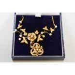 An Edwardian pearl floral spray necklace, having detachable pearl and diamond pendant brooch,