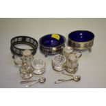 Three pierced silver salts; together with two silver cruet stands, having silver mounted glass