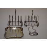 A pair of silver four slice toast racks, by Charles Wilkes, Birmingham 1930; together with two other