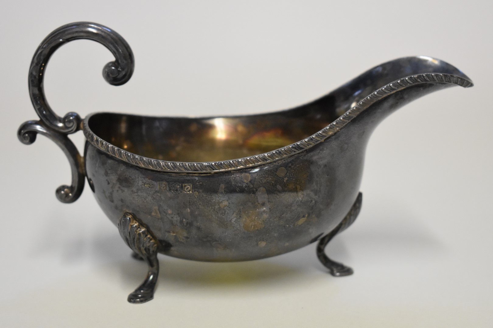 A silver sauce boat, by D Bros, Birmingham 1963, 10cm high, 192g.