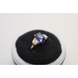 A cushion cut sapphire and diamond platinum ring, 2.5g total weight.