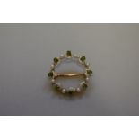 A demantoid garnet and pearl gold brooch, having enamel decoration, stamped 15ct, 3.3g total weight.