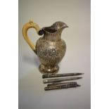 A Continental white metal ivory handled ewer; together with two silver pencils; a Morden & Co