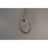 A diamond encrusted white gold pendant, stamped 750, set diamonds, 0.8ct approximately.