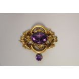 A large Victorian amethyst set unmarked brooch, 7cm wide, 32.5g total weight.