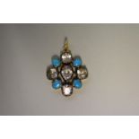 An antique turquoise and crystal set yellow metal pendant.