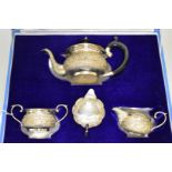 A cased Indian white metal four piece teaset, stamped 'silver' to base, 821g all in.