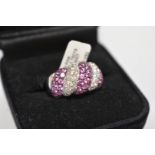 A diamond and pink sapphire white gold ring, stamped 750, set diamonds 1.5ct and sapphires 2.75ct