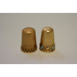 Two unmarked yellow metal thimbles, one decorated turquoise, 10.5g total weight.