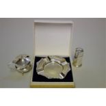 A silver ashtray, by Adie Bros Ltd, Birmingham 1961; together with a silver part cruet set, 109g all