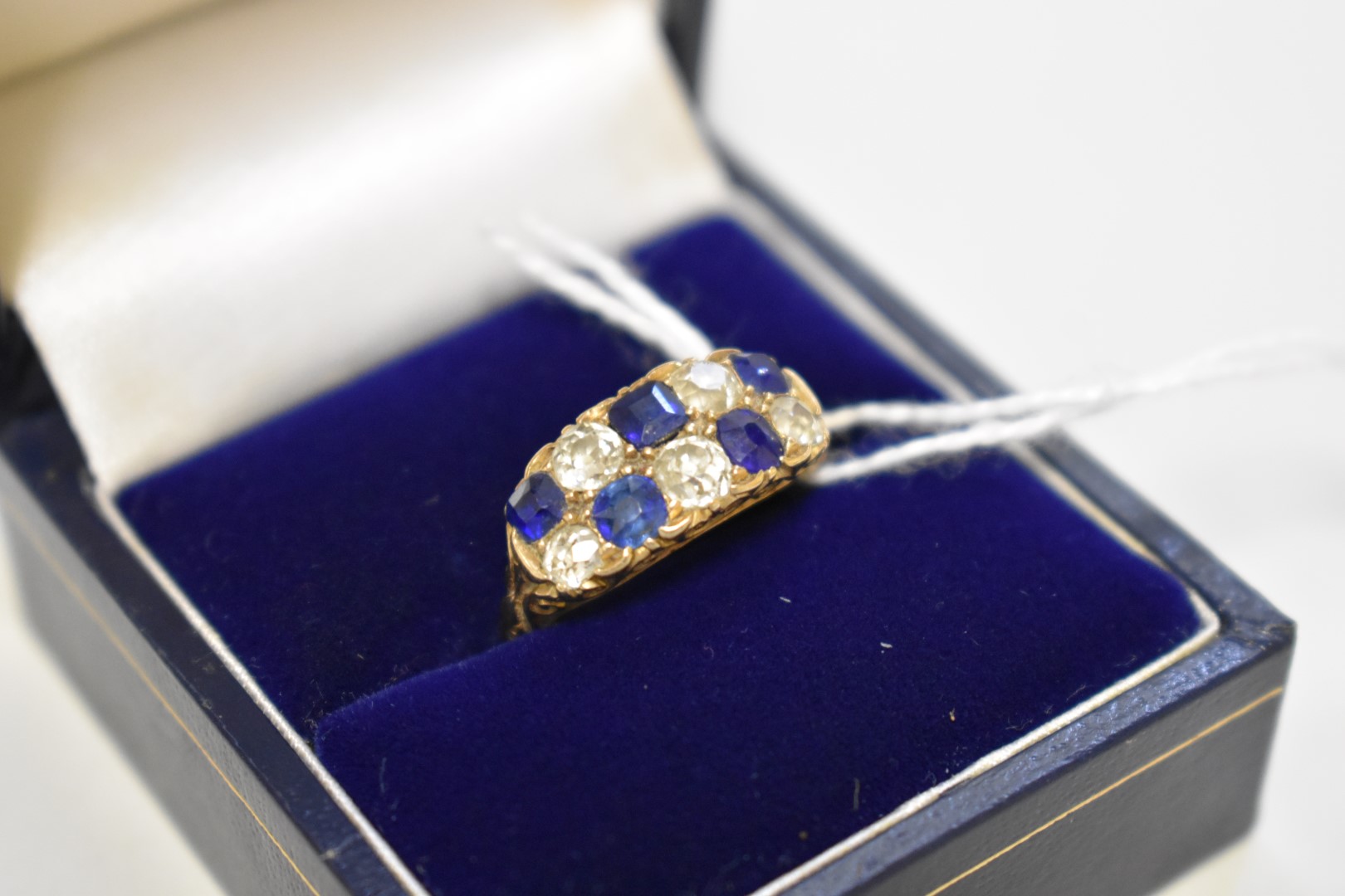 A sapphire and diamond gold ring, hallmarked 18ct, 4.2g total weight, (shank cut).