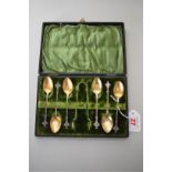 A cased set of six late Victorian silver and gilt teaspoons and sugar tongs, by A J Bailey,