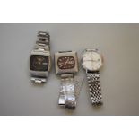 Three vintage Seiko stainless steel wristwatches.