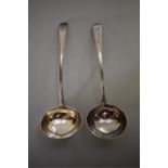 A pair of George III silver Hanovarian and bead pattern sauce ladles, makers mark indistinct, London