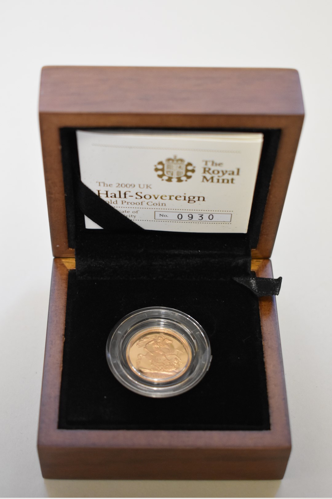 An Elizabeth II 2009 gold proof half sovereign, boxed.