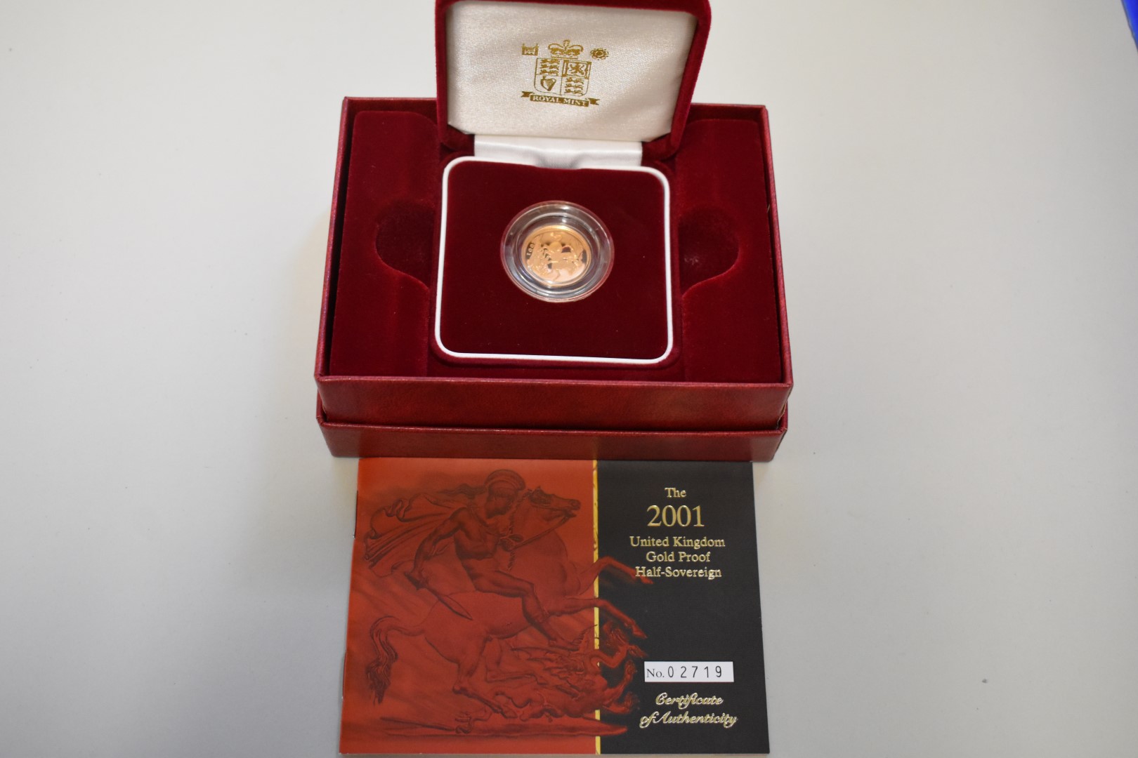 An Elizabeth II 2001 gold proof half sovereign, boxed.