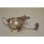 A silver sauce boat and ladle, by Thomas Turner & Co, Sheffield 1933/4, 134g,