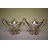 A pair of George III silver twin handled sauce tureens and covers, by John Denzilow, London 1787,