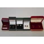 Three pairs of 9ct gold earstuds; together with another pair stamped 18ct; and an unmarked pair.(5)