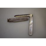 A silver engine turned smokers knife; together with a silver bladed mother of pearl penknife. (2)
