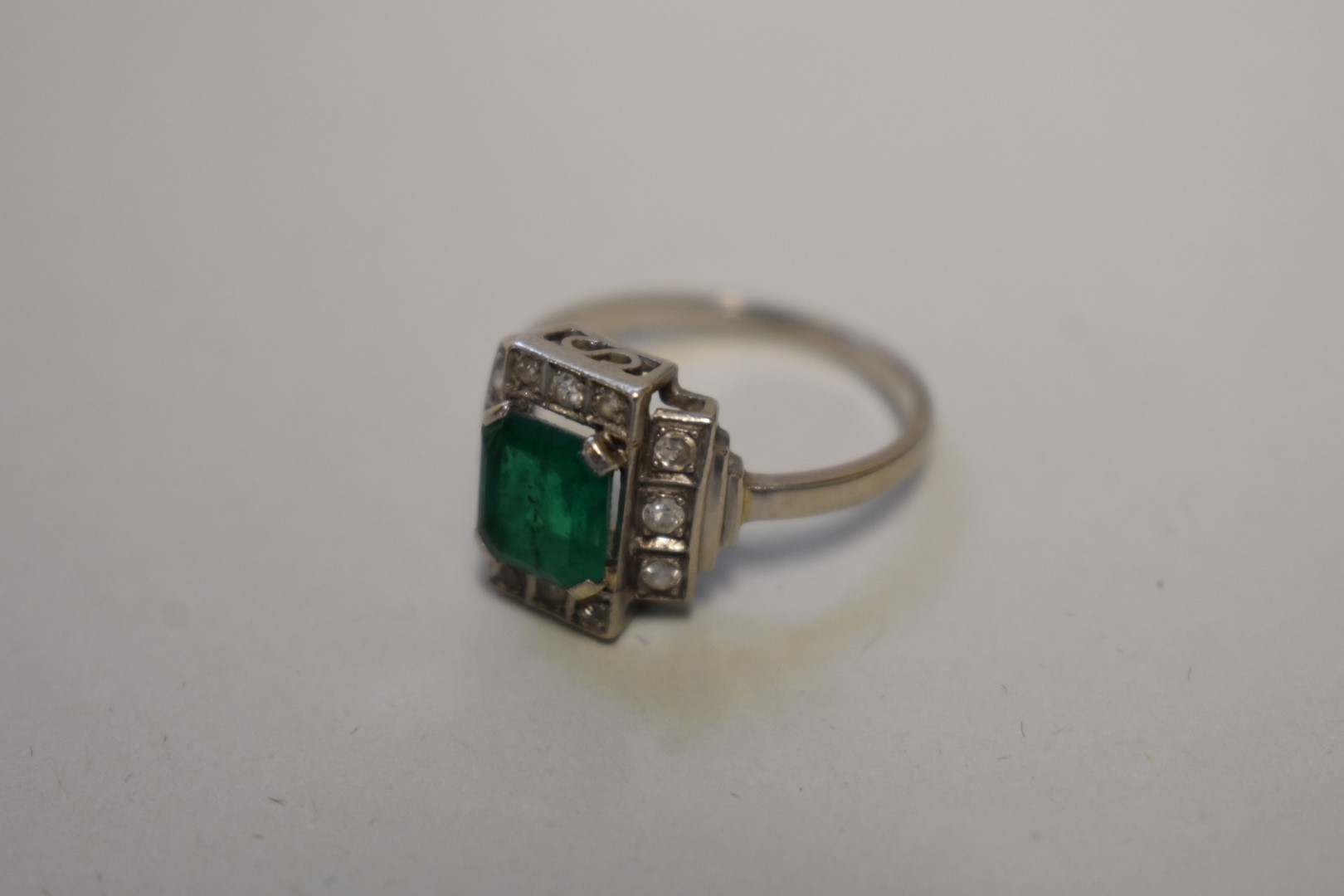 An Art Deco style square cut emerald and diamond unmarked white gold ring, 4.5g total weight. - Image 2 of 3