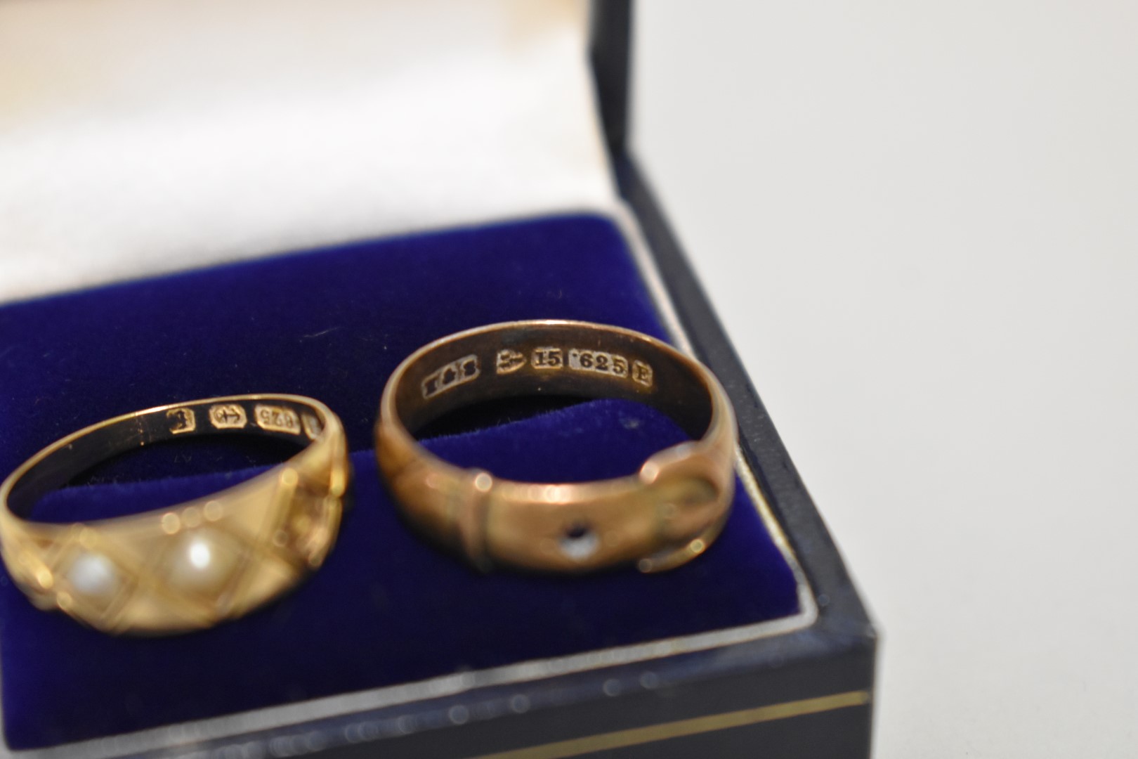 A seed pearl gold ring; together with a gold buckle ring, both stamped 15ct, 4.2g. - Image 2 of 2