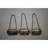 Three silver decanter labels, sherry, whisky & gin, by Francis Howard Ltd, Sheffield 1982/3/7, 28g.