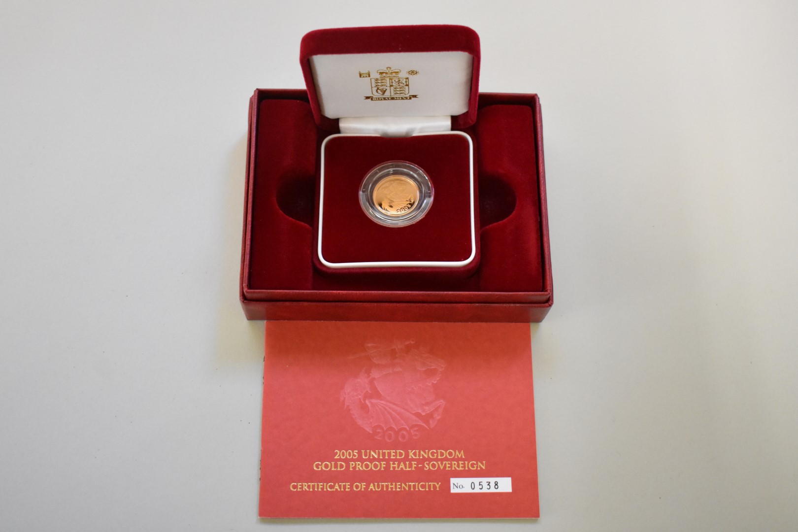 An Elizabeth II 2005 gold proof half sovereign, boxed.