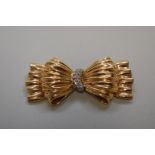 A Tiffany & Co gold and diamond set bow brooch, stamped 14k, 65mm, 24g total weight.