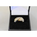 A diamond set cluster gold ring, hallmarked 9ct, approximately, 5.4g total weight.