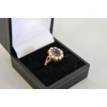 An amethyst and pearl gold ring, hallmarked 9ct, 3.7g total weight.