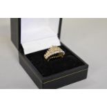 A diamond cluster gold ring, hallmarked 14ct, 0.5ct approximately, 5.6g total weight.