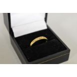 A diamond seven stone half eternity gold ring, hallmarked 9ct, 1.8g total weight.