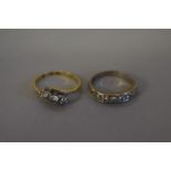 A diamond white gold half eternity ring; together with a diamond trilogy gold ring, both