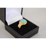 A opal gold ring, hallmarked 18ct, 7.7g total weight.